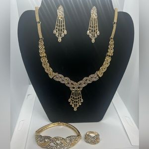 Necklace and earrings bracelet and ring.